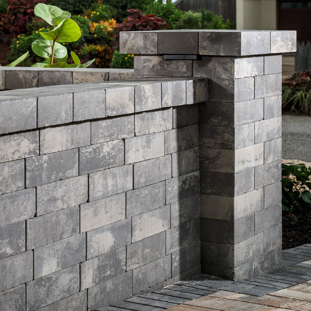 Cozy stone patio pavers creating a welcoming backyard lounge area.